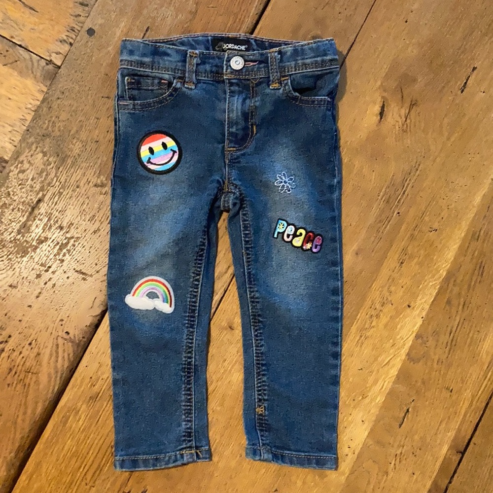 Blue jeans with sewn on patches